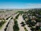 Top view row of new development three story townhomes next to single family residential area with highway in background