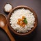 top view of Sabudana served in a bowl with wooden spoon