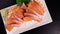 Top view Salmon Sashimi with wasabi on table.