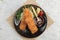 Top view of Salmon tempura sticks is deep fried salmon mixing with tempura flour served with sweet sauce.