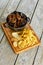 Top view saucepan with mussels and side dish.