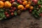 Top view of scattered tomatoes near tomatoes and spinach on pizza pan on wooden table.