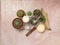 Top view of scented incense stick, various cactus and candles on pink sandy table