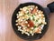 Top view Scrambled eggs with bacon, salmon and croutons