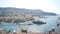 Top view of sea city with moored yachts. Action. Panoramic view of old town located on sea coast with yachts on shore