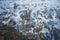 Top view of the sea wave and rocks. The water forms a whimsical pattern. Background, texture