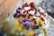 Top view of selection of colorful and delicious cake desserts on tray on table.