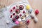 Top view of selection of colorful and delicious cake desserts on tray on table.