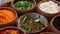 Top view of selection of various platters with delicious asian food and spices on a street market stall in Bangkok, Thailand