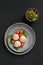 Top view of semifinished frozen veal meatballs on a plate