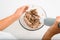 Top view of senior woman\'s hands preparing cream pie filling, housewife whipping ingredients using blender mixer indoors