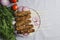 Top view of served table, fresh cooked lule kebab,onion rings,bunch of dill and tomatoes