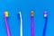 top view set of four color classic toothbrush on color surface flat lay s