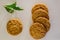 Top view of several oatmeal cookies with bay leaf