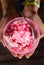 Top view of shaved ice in thai style with red syrup , condensed milk in pink bowl