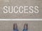Top View of Shoes on the floor with the text: Your Success Starts Here