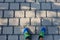 Top view shot of male feet in blue sneakers on the tiled ground