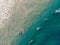 Top view shot of people with surfboards swimming in Varkala Beach