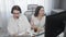 Top view shot of two female call center operators working online together