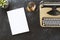 Top view shot of workspace with a typewriter and magazine mockup on blackboard table top