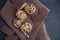 Top view shot of yummy cookies and a bar of chocolate on a brown towel