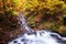 Top view of the Shypit waterfall in Carpathian mountains, autumn landscape, popular tourist attraction