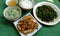 Top view simple vegan meal for daily family menu, fried tofu cook with sauce, water spinach, vegetables soup, rice