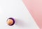 Top view of single egg on white and diagonal pink background