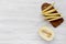 Top view, sliced melon on white wooden table. Flat lay, overhead.