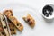 top view of sliced olive and onion focaccia on a white background, Flatlay of focaccia with black olives and red onion topping