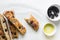 top view of sliced olive and onion focaccia on a white background, Flatlay of focaccia with black olives and red onion topping