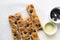 top view of sliced olive and onion focaccia on a white background, Flatlay of focaccia with black olives and red onion topping