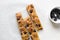 top view of sliced olive and onion focaccia on a white background, Flatlay of focaccia with black olives and red onion topping