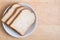 Top view of sliced wholegrain breads on wooden with space