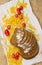 Top view of slices of bread sprinkled with flour, Italian pasta and tomatoes on white paper and canvas