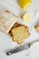 Top view of slices of glazed lemon pound cake loaf with poppy seedseed