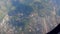 Top view small airport runway and local town on Thailand mountain hill area aerial plane window scene