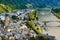 Top view of the small medieval german town Cochem, the river Mosel with ships and green hills