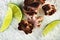 Top view of small octopus and three slices of lime on a coarse s