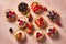 Top view of small tarts with cream and berry fruits