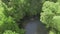 top view of small waterfall with blue lake