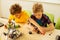 Top view of smart nice boys constructing toys