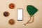 Top view of smartphone with white screen, rosary lying next to dried fruits, religious concept, love of Islam, copy space, mock up