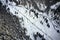 Top view of a snowy mountain landscape with trees and road. Almaty, Kazakhstan.