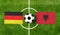 Top view soccer ball with Germany vs. Albania flags match on green football field