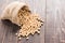 Top view soybean on wooden background and empty space.