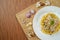 Top view of spaghetti carbonara lunch dinner meal on brown wooden table
