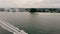 Top view of a speedboat leaving the city of St. Petersburg Florida near the coastline on a cloudy day. Transportation of