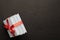 Top view stack of books tied with ribbon on a dark background with copy space