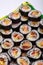 Top view of stack of Japanese sushi maki roll plate